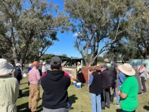 A group of people gathered around a person speaking