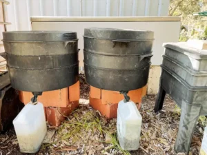 Two water drums with bottles